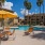a pool with chairs and umbrellas by it